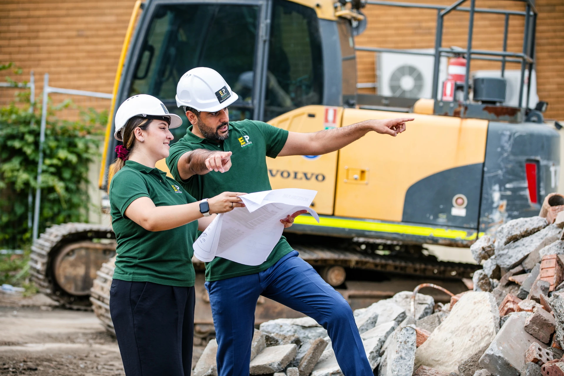 Equinox Projects site team reviewing drawings on a live construction site